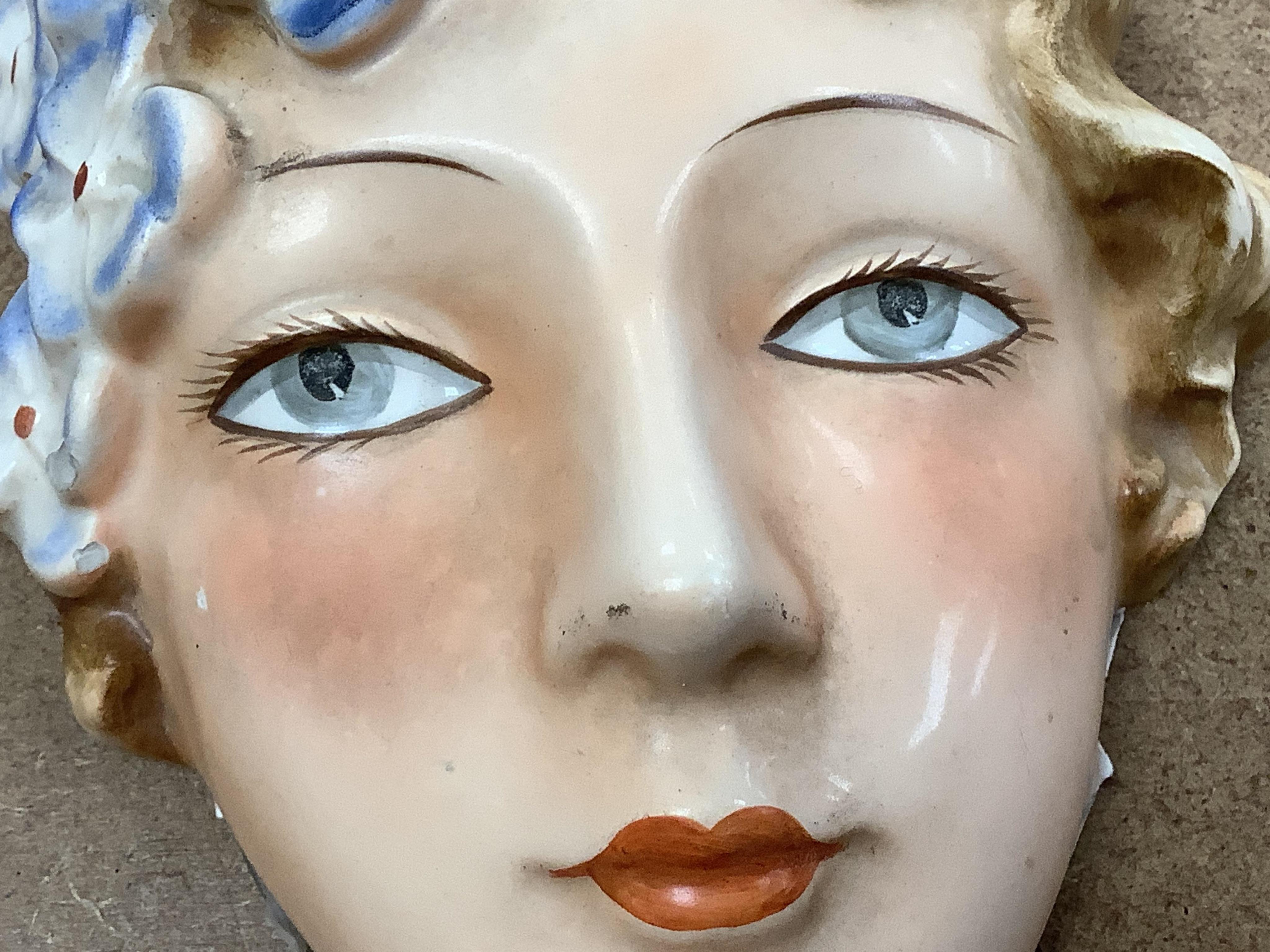 An Art Deco Goebel earthenware wall mask, 16cm high
